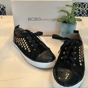 BCBG gold studded black sneakers